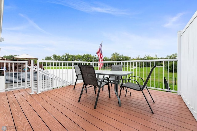 deck featuring a lawn