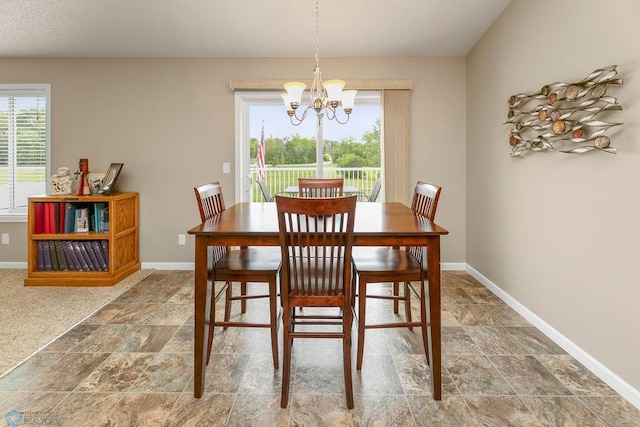 dining room featuring a notable chandelier