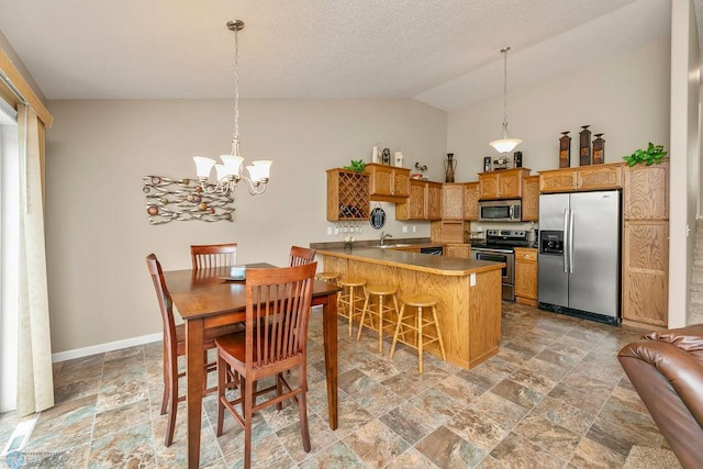 dining space with lofted ceiling, sink, a notable chandelier, and a textured ceiling