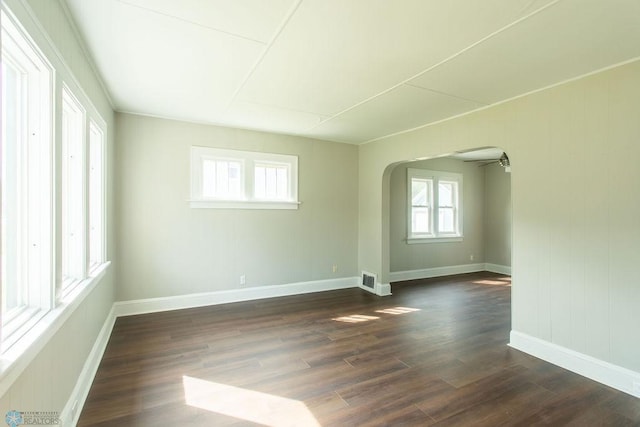 unfurnished room featuring dark wood-type flooring