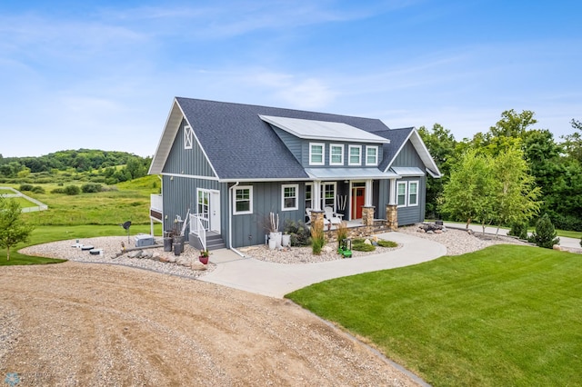 craftsman house with covered porch and a front lawn