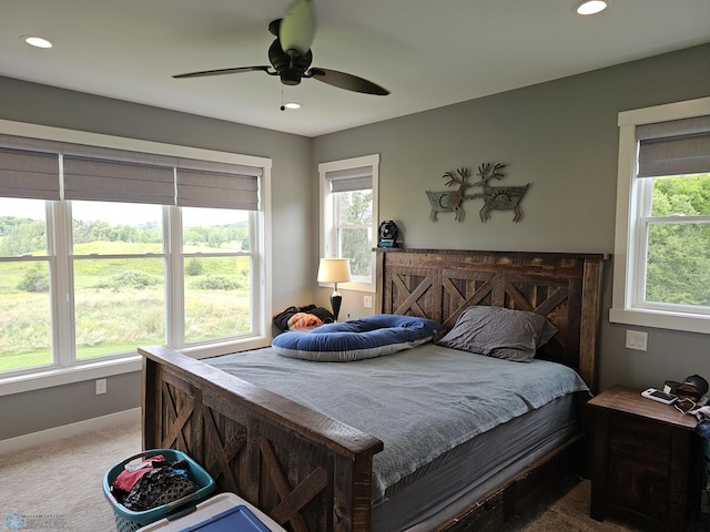 bedroom with ceiling fan and carpet