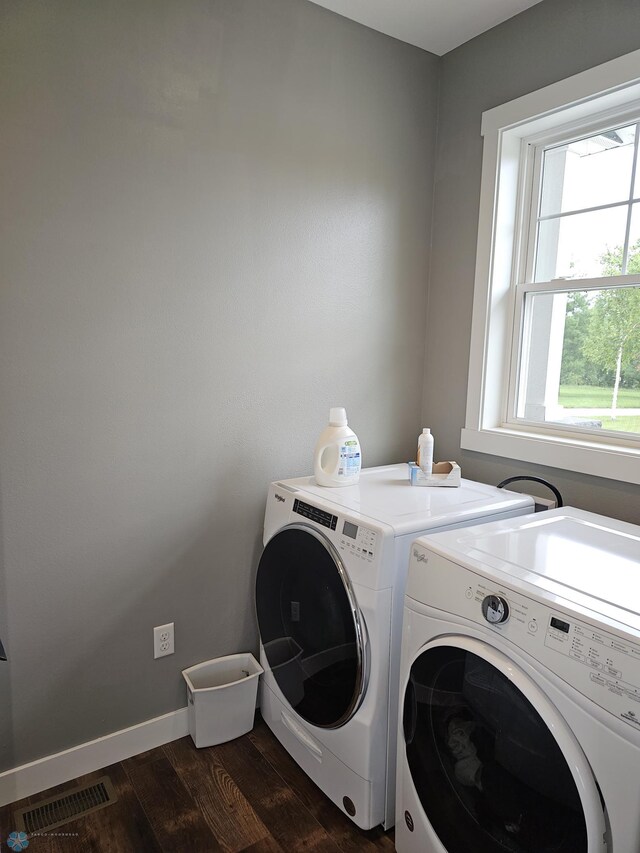 laundry room with dark hardwood / wood-style flooring and separate washer and dryer