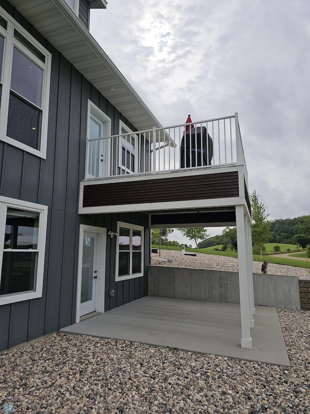 exterior space featuring a balcony and a patio area