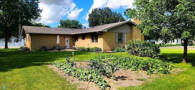 single story home with a front lawn and a garage