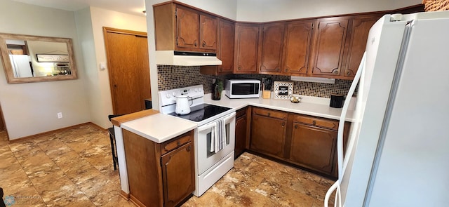 kitchen featuring white appliances and decorative backsplash