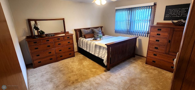 bedroom with light colored carpet and ceiling fan