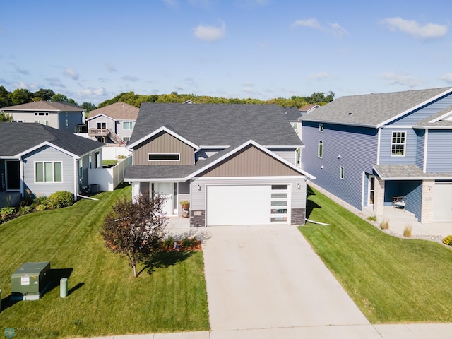 view of front facade featuring a front yard and a garage