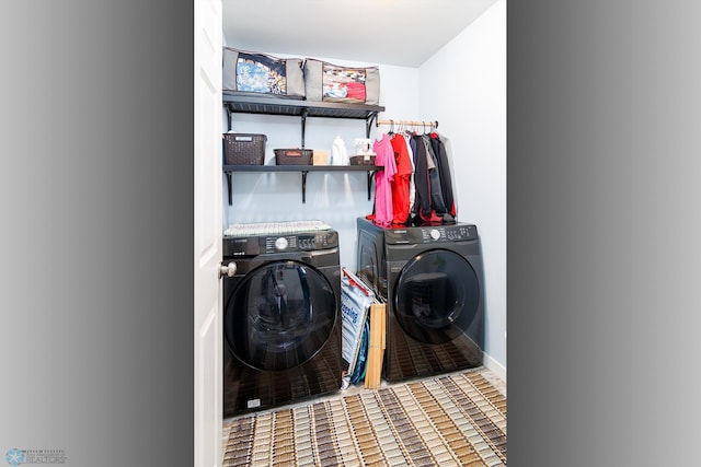 washroom featuring washer and clothes dryer