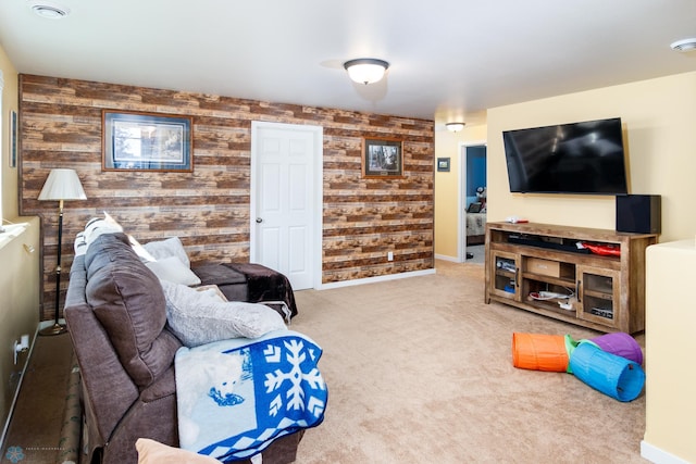 living room with carpet floors and wooden walls