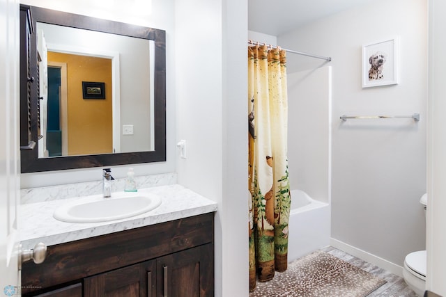 full bathroom with shower / bath combination with curtain, vanity, and toilet