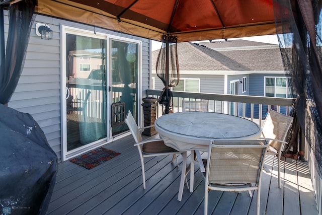 wooden terrace with a gazebo