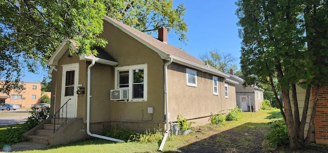 view of property exterior featuring a lawn