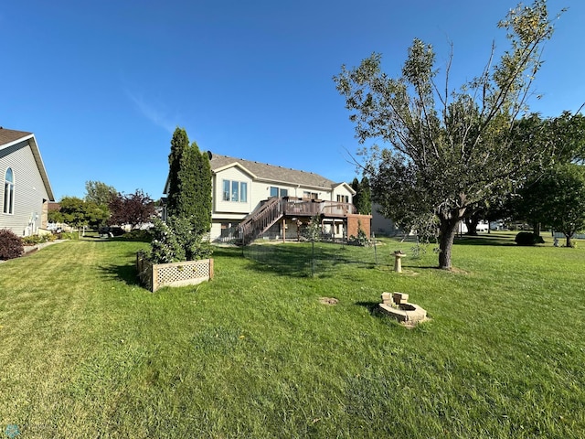 view of yard featuring a wooden deck