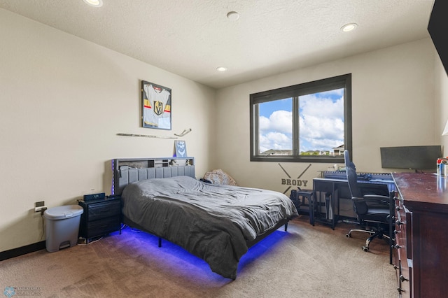 carpeted bedroom featuring a textured ceiling