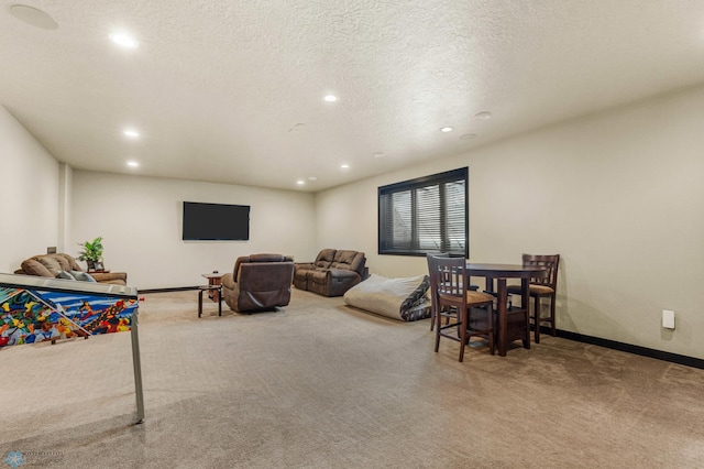 carpeted living room with a textured ceiling