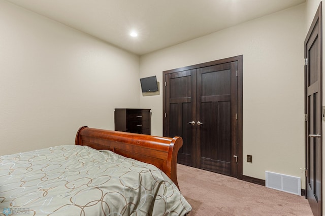 bedroom with a closet and carpet