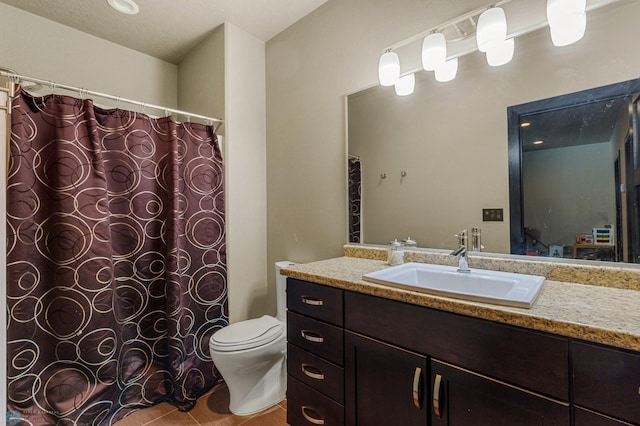 bathroom with vanity, toilet, and walk in shower