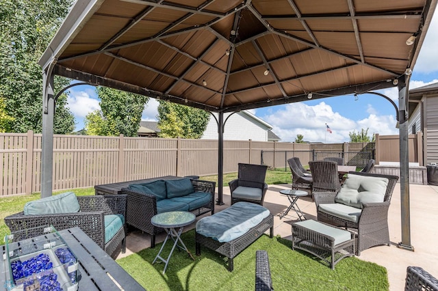 view of patio / terrace with an outdoor living space and a gazebo