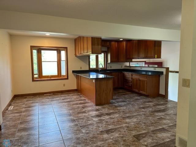 kitchen with kitchen peninsula and sink