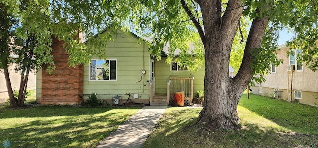 view of front of property with a front lawn