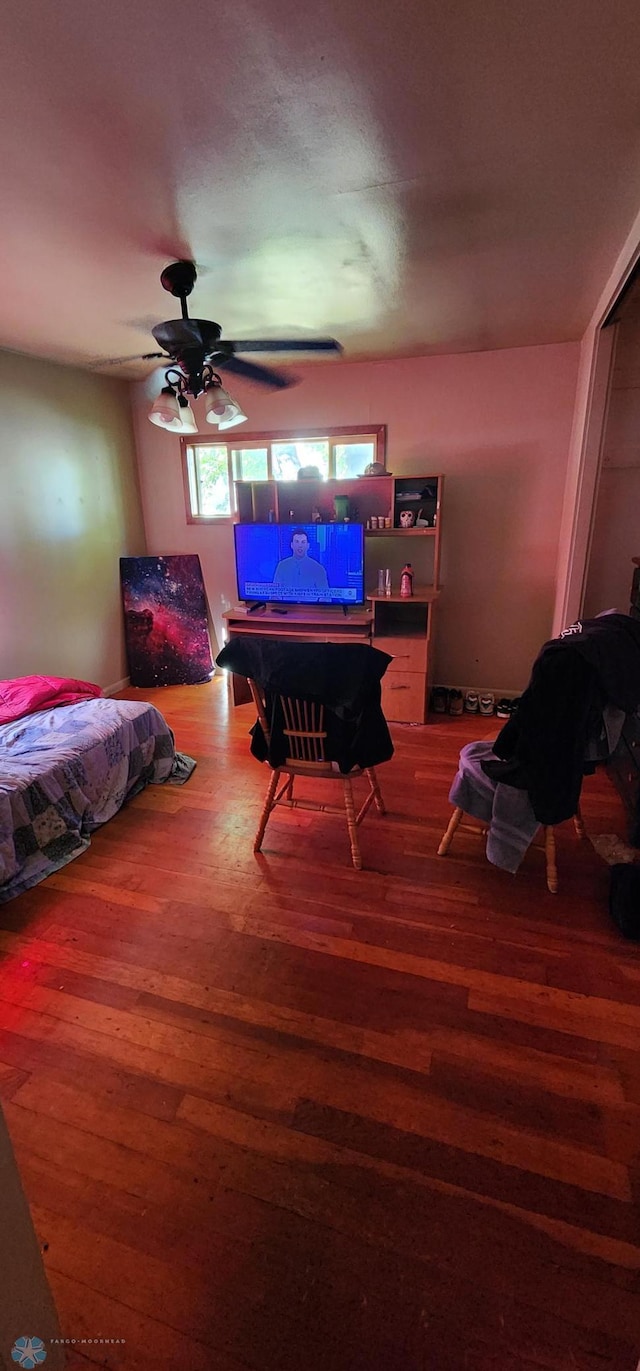 bedroom with wood-type flooring and ceiling fan