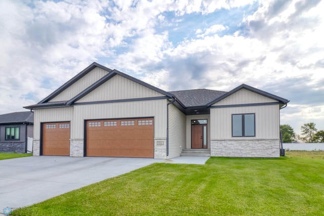 view of front of house featuring a garage and a front yard