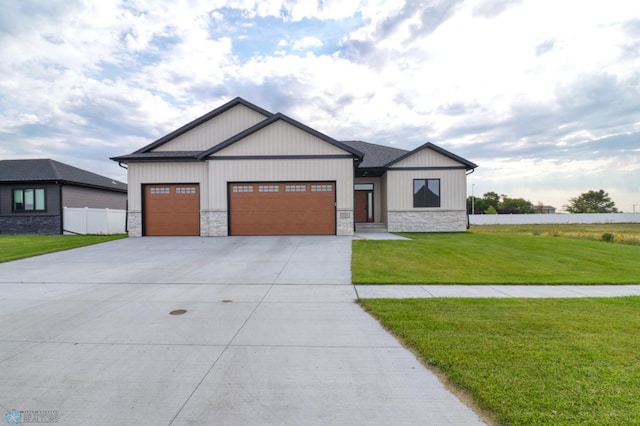 view of front facade with a garage and a front lawn