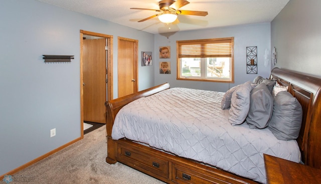 bedroom with light carpet and ceiling fan