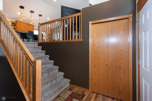 staircase featuring hardwood / wood-style flooring