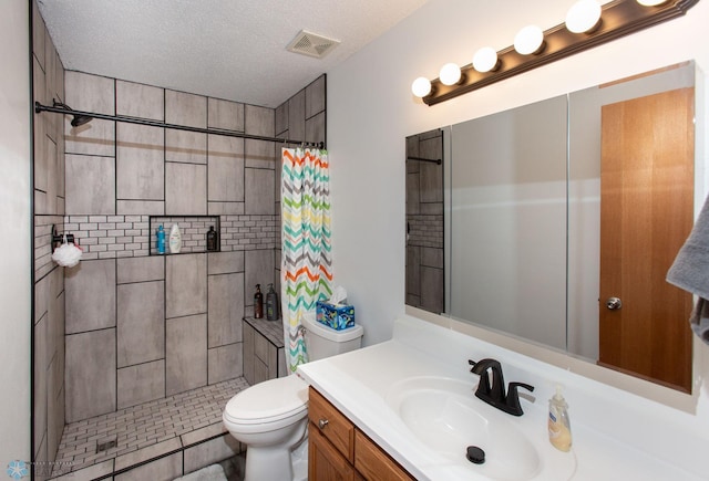 bathroom with vanity, toilet, a textured ceiling, and a shower with shower curtain