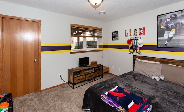 carpeted bedroom with a textured ceiling