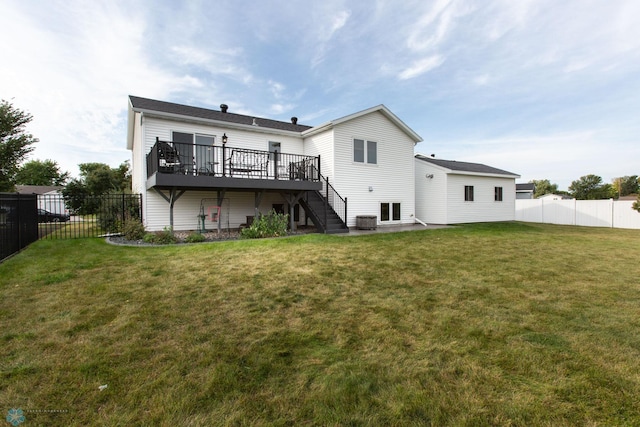 back of property featuring cooling unit, a deck, and a yard