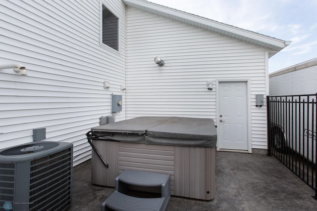 view of patio featuring a hot tub and central AC unit