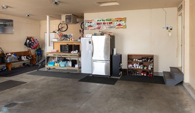 garage with stainless steel fridge