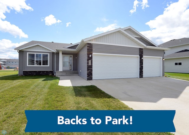 view of front of home featuring a garage and a front lawn