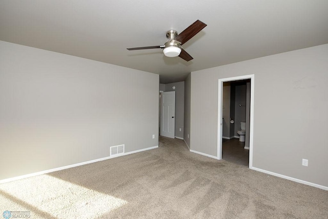 interior space with carpet and ceiling fan