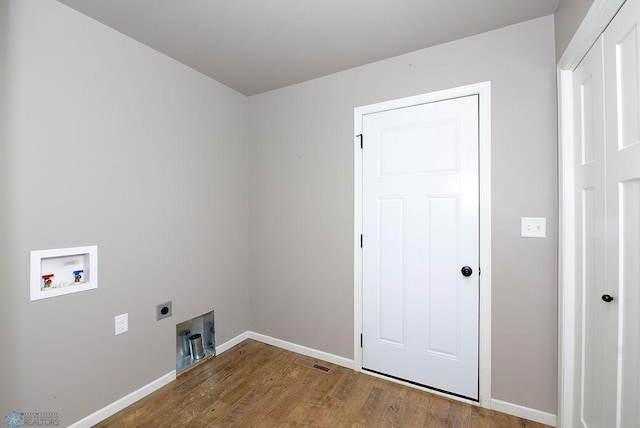 clothes washing area with light wood-type flooring, washer hookup, and electric dryer hookup