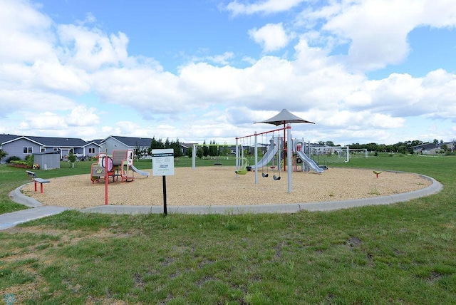 view of jungle gym featuring a lawn