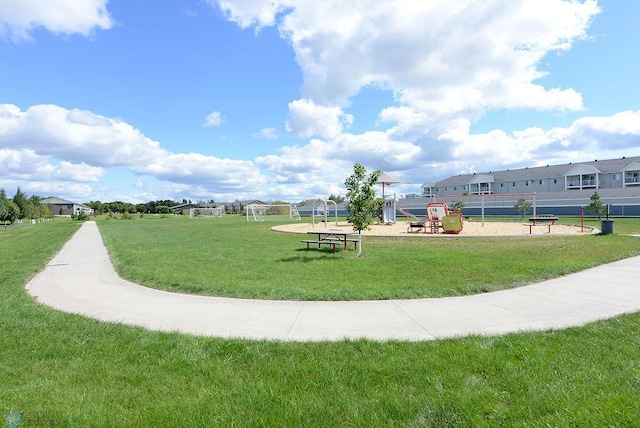 view of community with a playground and a yard