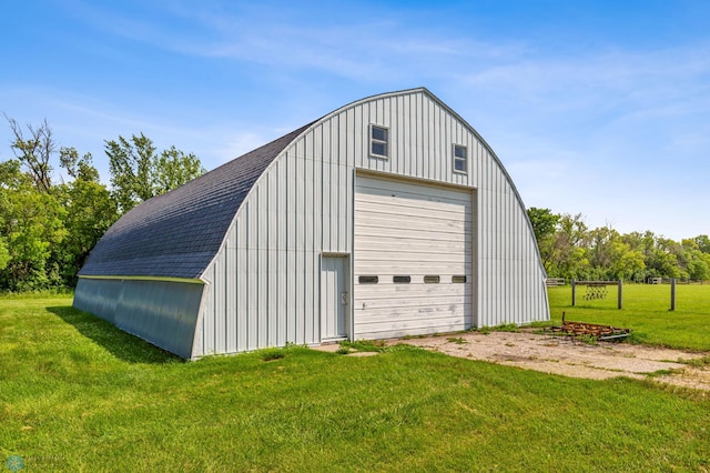 garage featuring a lawn