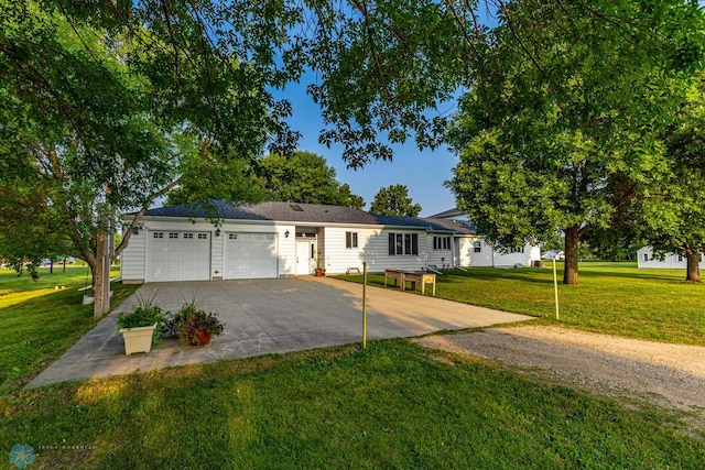 single story home with a front yard and a garage