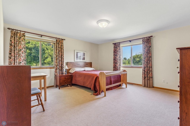 bedroom with light colored carpet