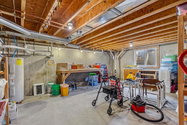 basement with a workshop area and electric water heater