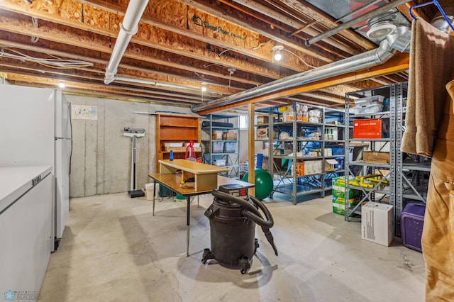 basement with white refrigerator