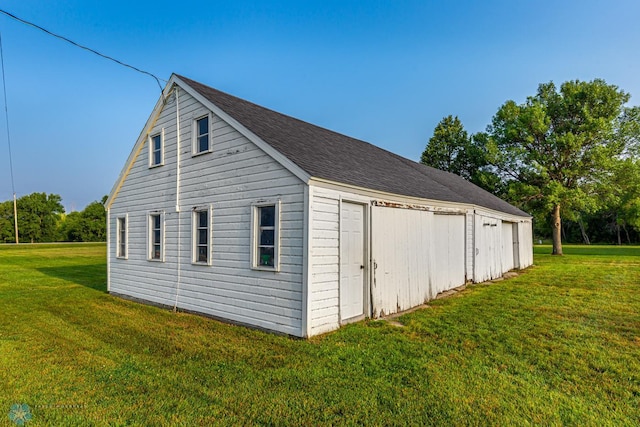 view of side of property with a lawn