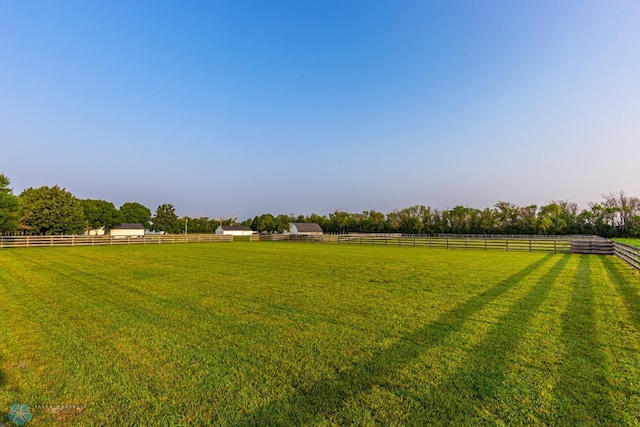 view of yard with a rural view