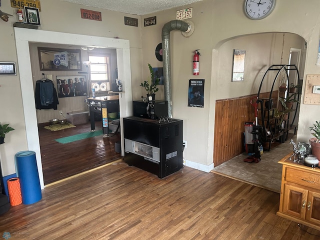 living room featuring a textured ceiling and hardwood / wood-style flooring