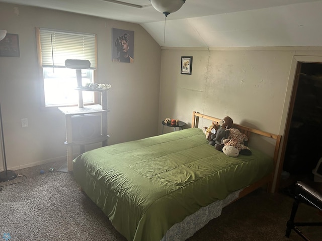 bedroom featuring vaulted ceiling and carpet flooring