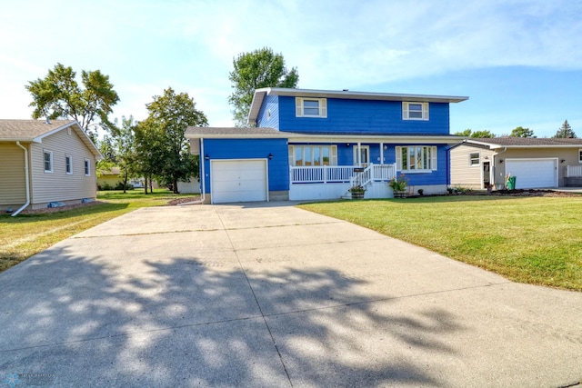 view of front property with a garage, a porch, and a front lawn